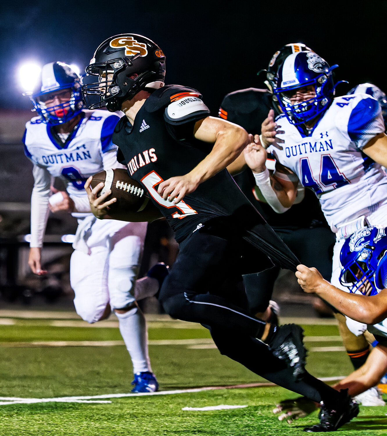 Jaxon Wilson and Landon Green come to their teammate's aid in tracking down Grand Saline quarterback Jett Taylor. [few more photos here]